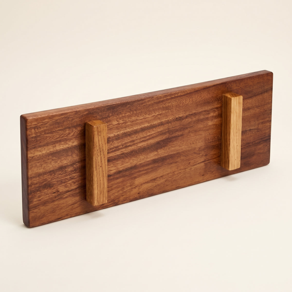 Bottom view of solid walnut Japanese sushi tray displaying raised feet and craft maker mark