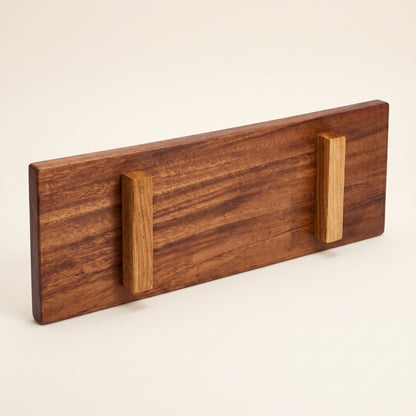 Bottom view of solid walnut Japanese sushi tray displaying raised feet and craft maker mark