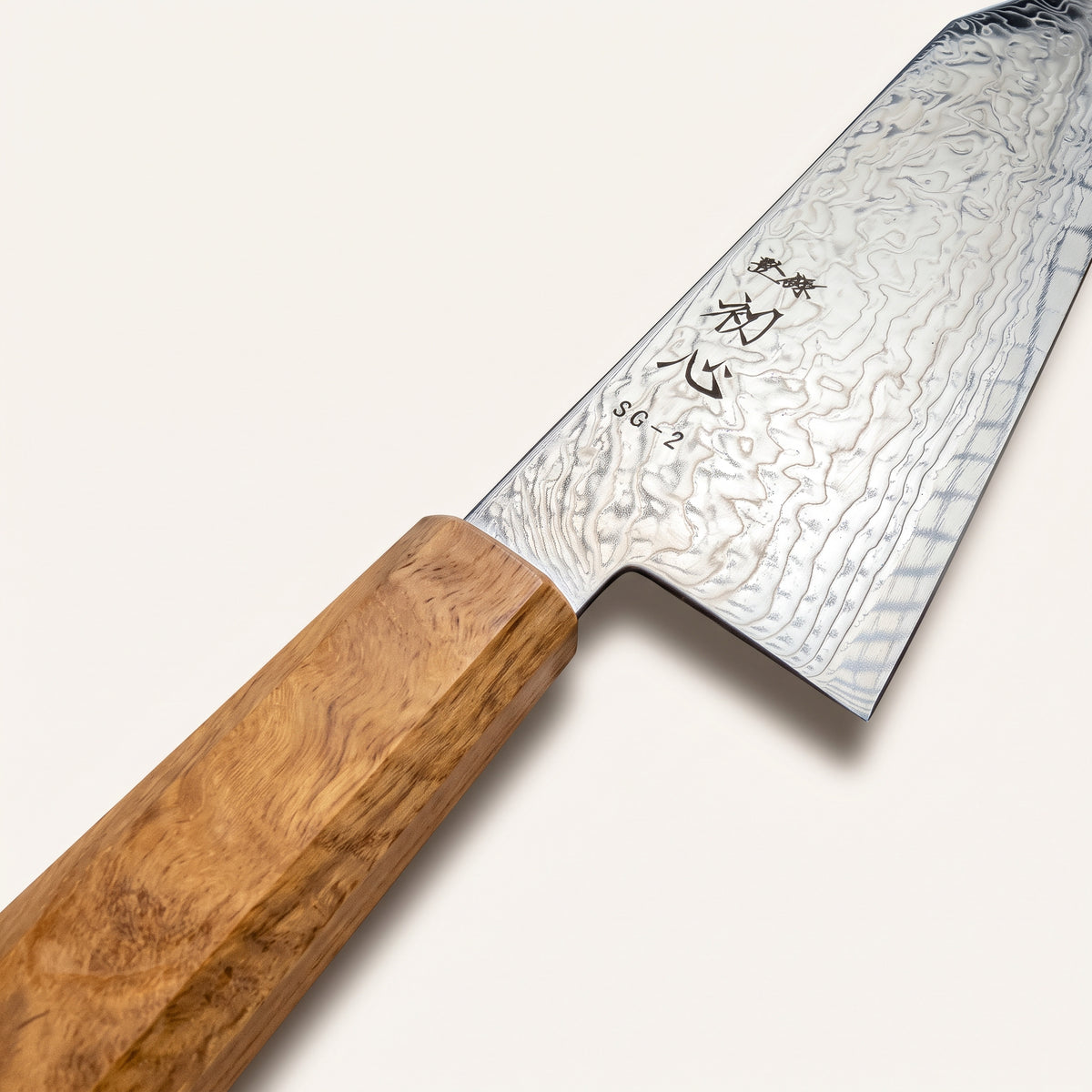 Choil shot showing ultra-thin blade geometry, 50-50 double bevel grind, and polished architectural spine