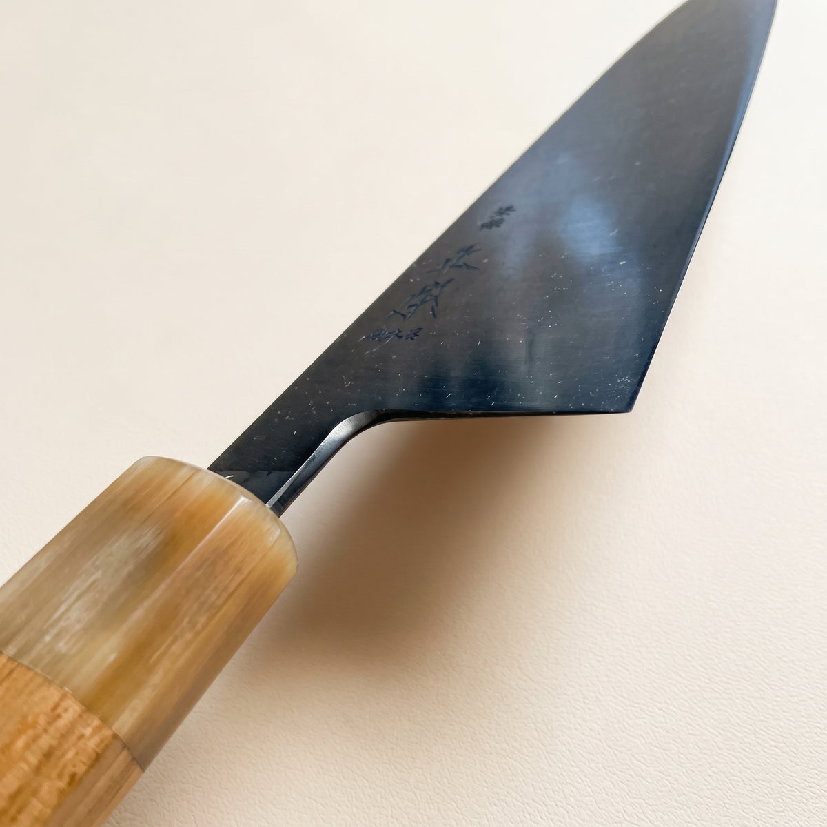 Choil shot showing laser thin edge geometry of Masamoto KS3124 Gyuto blonde handle