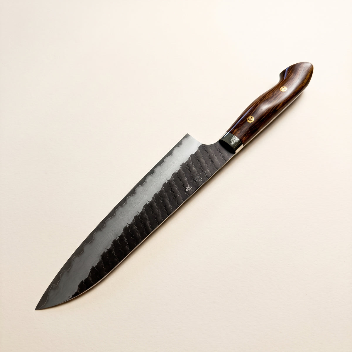 Nigara SG2 Kurouchi Hexagonal Tsuchime Gyuto 210mm with Western full-tang desert ironwood handle on dark background