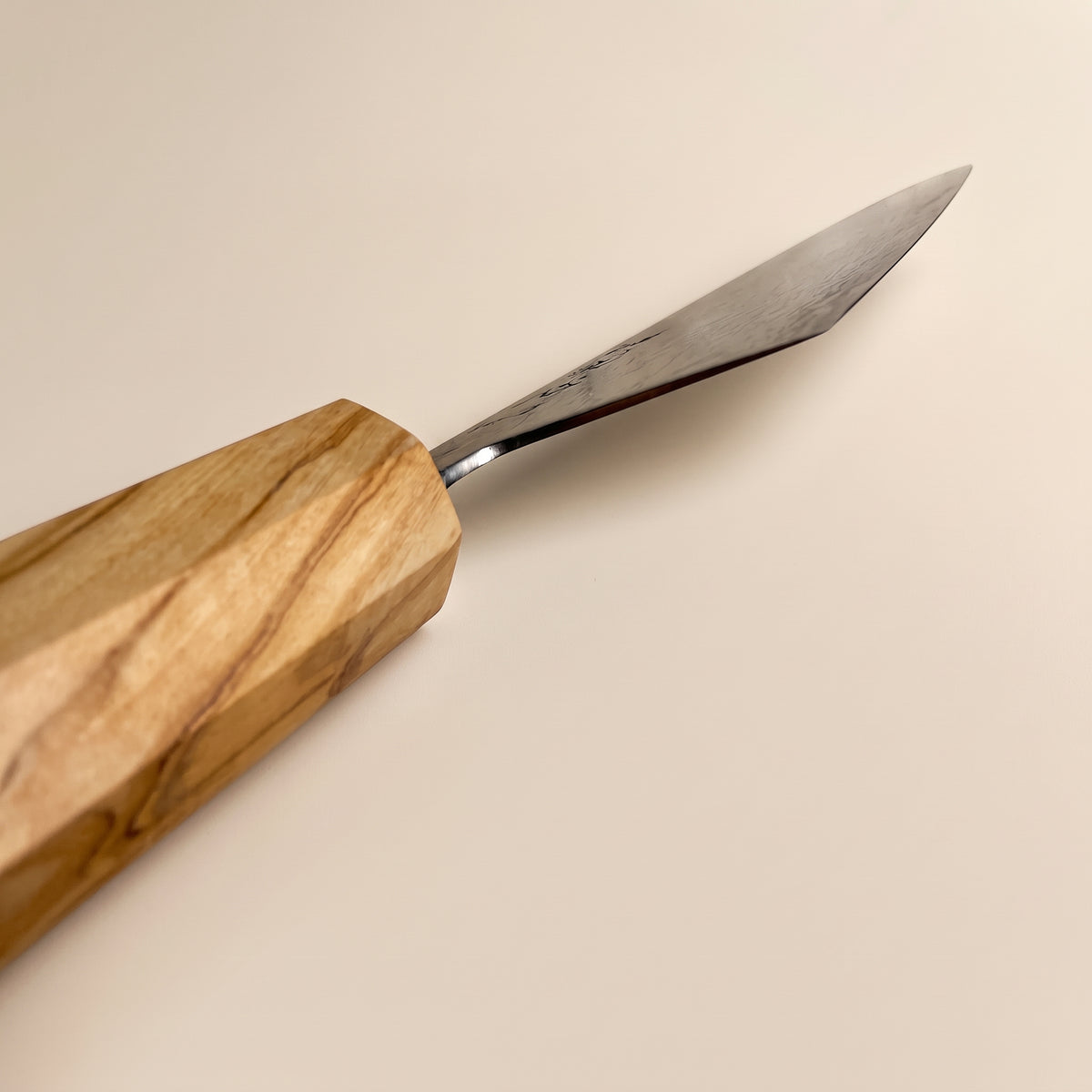 Choil view showing ultra-thin blade geometry behind the edge and 50-50 double bevel polish of the Hatsukokoro Ryuhyo Gyuto