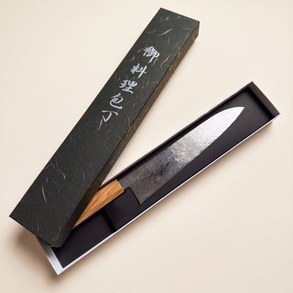 Hatsukokoro Ryuhyo 240mm Gyuto showing SG2 damascus steel migaki polished finish and octagonal olive wood wa-handle in original box