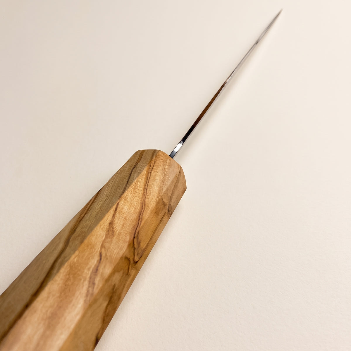 Choil view showing ultra-thin blade geometry behind the edge and 50-50 double bevel polish of the Hatsukokoro Ryuhyo Gyuto thin polished choil